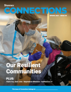 Spring 2021 cover of Shannex Connections magazine with resident receiving their vaccination from a healthcare professional wearing personal protection equipment