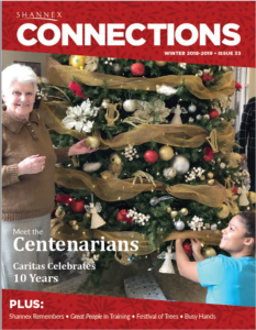 Winter 2018-2019 cover of Shannex Connections magazine with a resident and team member smiling while decorating a tree
